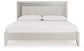 Zyniden King Upholstered Panel Bed with Mirrored Dresser and Chest