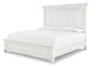 Kanwyn King Panel Bed with Mirrored Dresser, Chest and Nightstand